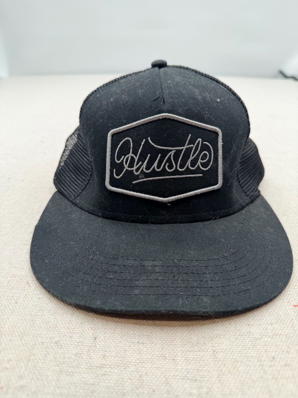 Carbon Black 'Hustle' Patch Trucker Hat